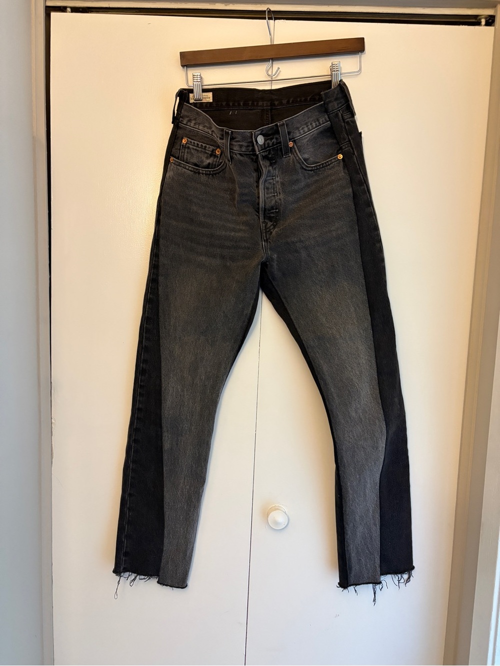 Levi’s 501 spliced jeans in black and gray. 27